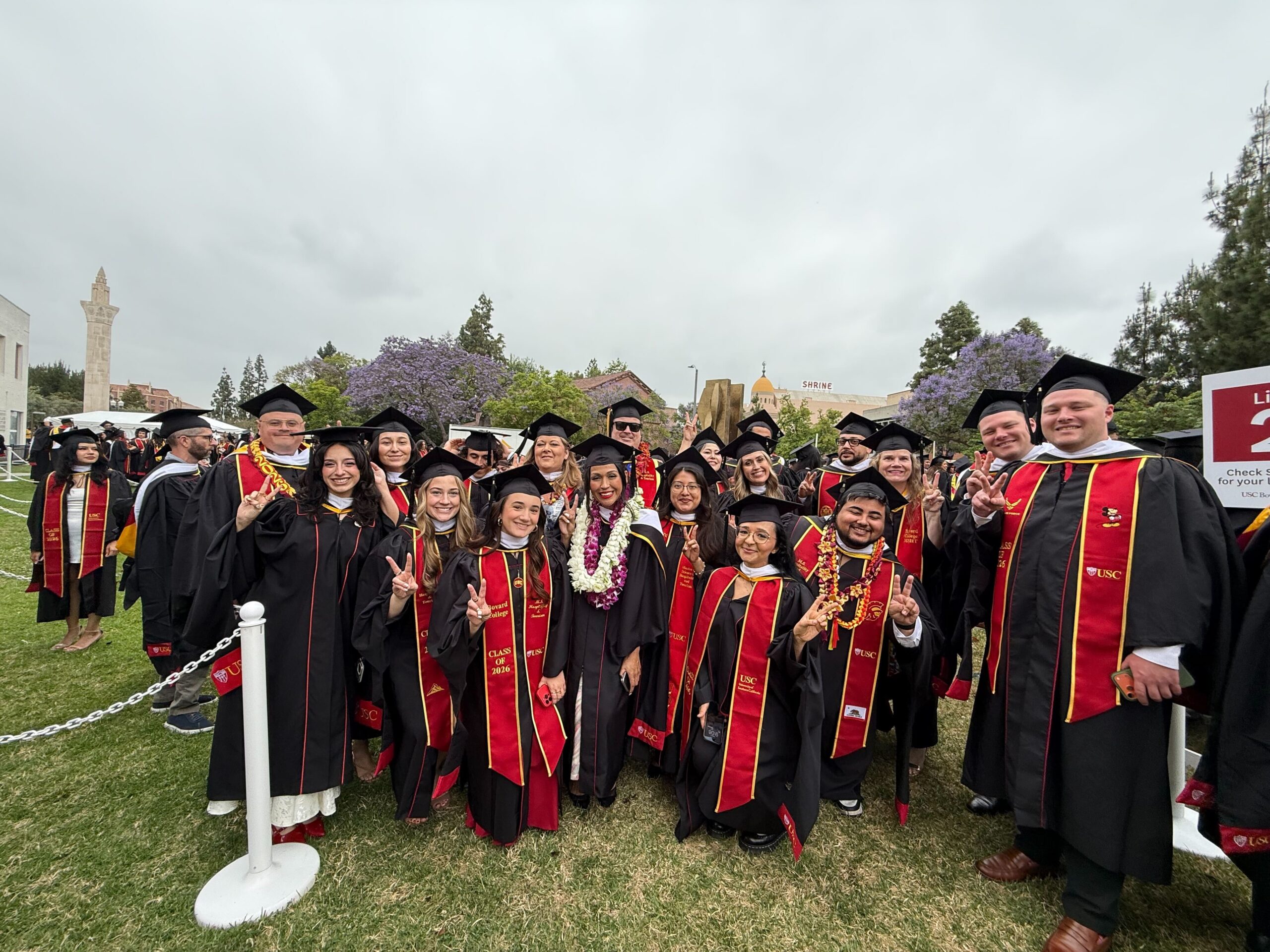 MSHT graduates standing together posing.